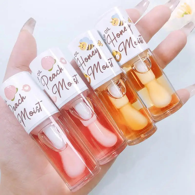 Pink lip oil with glossy shine